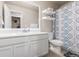 Full bathroom featuring a single sink vanity, toilet, tub, and decorative shower curtain at 1933 Griffin Dr, Brighton, CO 80601