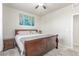 Bedroom featuring a bed, three panel painting, bedside table and lamp at 1933 Griffin Dr, Brighton, CO 80601