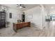 Bright home office with a spacious wooden desk and neutral decor at 1933 Griffin Dr, Brighton, CO 80601
