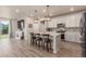 Well-lit kitchen with an island for extra seating, stainless steel appliances, and a cozy breakfast nook at 1933 Griffin Dr, Brighton, CO 80601