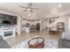 Open-concept living room with a view into the kitchen and dining area, offering a great space for Gathering gatherings at 1933 Griffin Dr, Brighton, CO 80601