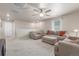 Open concept living room featuring neutral tones, plush seating, and ample space for relaxation and entertainment at 1933 Griffin Dr, Brighton, CO 80601