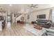 Inviting living room featuring wood floors, neutral paint, and a cozy seating area at 1933 Griffin Dr, Brighton, CO 80601