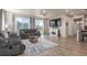 Bright and airy living room with hardwood floors, fireplace, large window and glass door to let in the natural light at 1933 Griffin Dr, Brighton, CO 80601