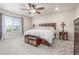 Spacious main bedroom featuring a king-sized bed and a window view at 1933 Griffin Dr, Brighton, CO 80601