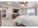 Comfortable main bedroom with king-size bed, dresser, and sitting area at 1933 Griffin Dr, Brighton, CO 80601
