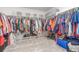Spacious walk-in closet with ample clothing racks and shelving provides plentiful storage at 1933 Griffin Dr, Brighton, CO 80601