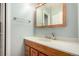 Bathroom with single sink vanity, cabinet, and updated fixtures at 902 S Yukon St, Lakewood, CO 80226