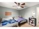 Charming bedroom featuring twin beds, plush bedding, and cozy decor at 902 S Yukon St, Lakewood, CO 80226
