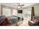 Comfortable bedroom with balcony access, ceiling fan and large closets at 902 S Yukon St, Lakewood, CO 80226