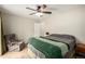 A bedroom offers a comfortable bed, accent chair, and a peaceful atmosphere at 902 S Yukon St, Lakewood, CO 80226