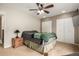 Bright bedroom with a ceiling fan, large closets, and cozy decor at 902 S Yukon St, Lakewood, CO 80226