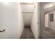 Hall closet with carpet, light fixture, and neutral walls at 902 S Yukon St, Lakewood, CO 80226