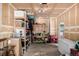 Spacious unfinished garage with shelves, overhead lighting, work bench and storage space at 902 S Yukon St, Lakewood, CO 80226