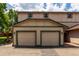 Attached two-car garage, adjacent to outdoor patio at 902 S Yukon St, Lakewood, CO 80226