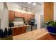 Functional kitchen with stainless steel appliances, wood cabinets, and a breakfast bar at 902 S Yukon St, Lakewood, CO 80226
