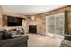 This cozy living room features modern decor, fireplace, and sliding glass doors at 902 S Yukon St, Lakewood, CO 80226