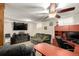 Comfortable living room features neutral carpet, sofa, and desk area at 902 S Yukon St, Lakewood, CO 80226
