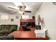 This home offers dedicated office space with built-in desk, chair, and neutral carpet at 902 S Yukon St, Lakewood, CO 80226