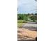 Cement park path with grass and trees on either side at 902 S Yukon St, Lakewood, CO 80226