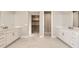 Large bathroom with and sinks and walk-in closet at 6190 Pedregal Dr, Parker, CO 80134