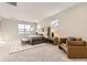 Main bedroom with plush carpet and a seating area at 6190 Pedregal Dr, Parker, CO 80134