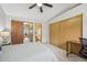 Cozy bedroom with carpet, ceiling fan, and closet, conveniently located near the bathroom at 912 S Paris Ct, Aurora, CO 80012