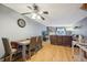 Inviting dining area with wood floors, a stylish table set and open to the living area at 912 S Paris Ct, Aurora, CO 80012