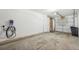 Spacious garage interior featuring a modern JuiceBox EV charger at 912 S Paris Ct, Aurora, CO 80012