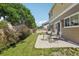 Backyard patio with a table and chairs, grassy lawn and privacy fence at 7371 S Mobile St, Aurora, CO 80016