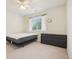 Bright bedroom with ceiling fan, window with blinds, and dark dresser at 7371 S Mobile St, Aurora, CO 80016
