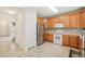 Well-lit kitchen featuring stainless steel refrigerator, modern appliances, and ample counter space at 7371 S Mobile St, Aurora, CO 80016