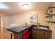 Stylish bar area with marble countertop and storage, perfect for entertaining at home at 2744 S Newton Way, Denver, CO 80236
