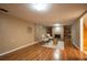 Finished basement featuring a decorative fireplace, seating, and vinyl floors at 2744 S Newton Way, Denver, CO 80236