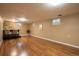 Finished basement featuring a bar area, modern floors, and natural light at 2744 S Newton Way, Denver, CO 80236