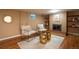 Inviting basement featuring a fireplace, modern seating, and decorative shelving at 2744 S Newton Way, Denver, CO 80236
