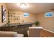 Finished basement featuring a bar with dark countertops and seating for two at 2744 S Newton Way, Denver, CO 80236
