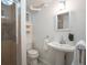 Charming bathroom featuring a shower, a sink, and a toilet for added convenience at 2744 S Newton Way, Denver, CO 80236
