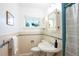 Bright bathroom with a pedestal sink, classic tile, and window with natural light at 2744 S Newton Way, Denver, CO 80236