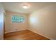 Spare bedroom featuring hardwood floors and a bright window at 2744 S Newton Way, Denver, CO 80236