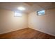 Cozy bedroom featuring wood floors and ample natural light at 2744 S Newton Way, Denver, CO 80236