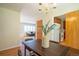 Comfortable dining room featuring hardwood floors and a view into the kitchen at 2744 S Newton Way, Denver, CO 80236