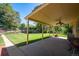 Relaxing covered patio that overlooks a lush backyard, perfect for enjoying the outdoors at 2744 S Newton Way, Denver, CO 80236