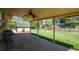 Inviting covered patio, ideal for enjoying the backyard view and outdoor relaxation at 2744 S Newton Way, Denver, CO 80236