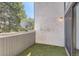 Cozy balcony featuring artificial turf flooring and a satellite dish, perfect for outdoor relaxation at 6470 S Dayton St # K12, Englewood, CO 80111