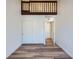 Bedroom with a loft, wood-look floors, and large closet with sliding doors at 6470 S Dayton St # K12, Englewood, CO 80111