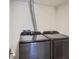 Laundry room features newer model Samsung washer and dryer in gray finish at 6470 S Dayton St # K12, Englewood, CO 80111