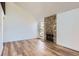 Spacious living room with a cozy stone fireplace and large window providing ample natural light at 6470 S Dayton St # K12, Englewood, CO 80111