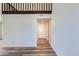 Bright and airy living room boasts hardwood floors and fresh paint leading to the front door at 6470 S Dayton St # K12, Englewood, CO 80111