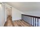 Loft with wood-look flooring, views of home interior, and bright interior at 6470 S Dayton St # K12, Englewood, CO 80111